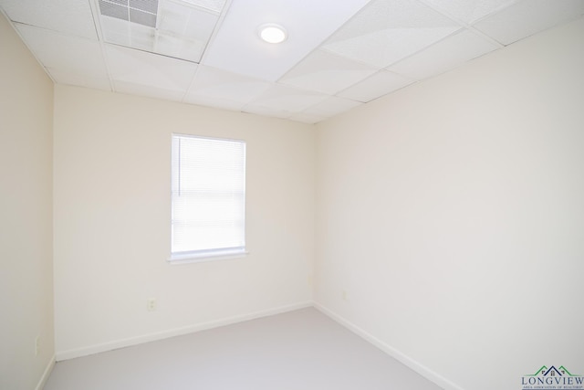 empty room with a paneled ceiling