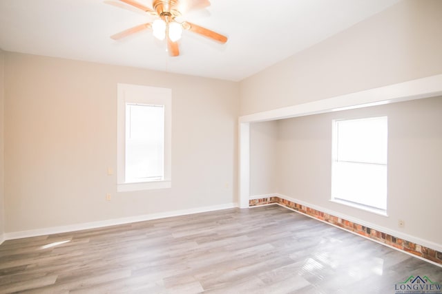 spare room with ceiling fan and light hardwood / wood-style flooring