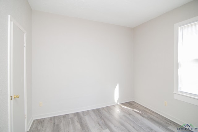 spare room featuring light wood-type flooring