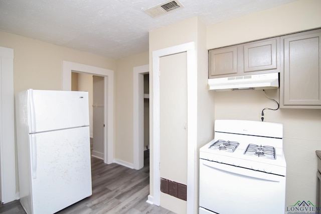 kitchen with white appliances, gray cabinets, a textured ceiling, and light wood-type flooring