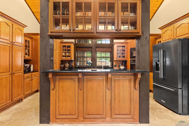 kitchen with wood ceiling, black appliances, and vaulted ceiling