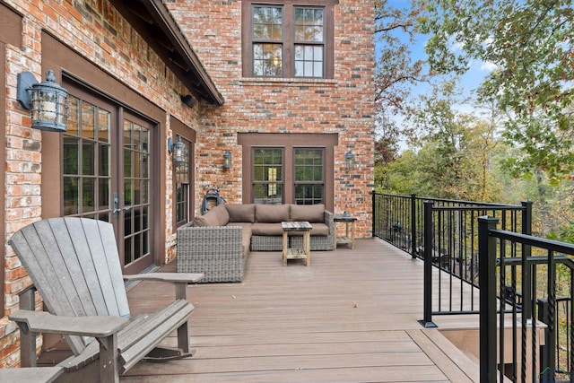 wooden deck with an outdoor living space