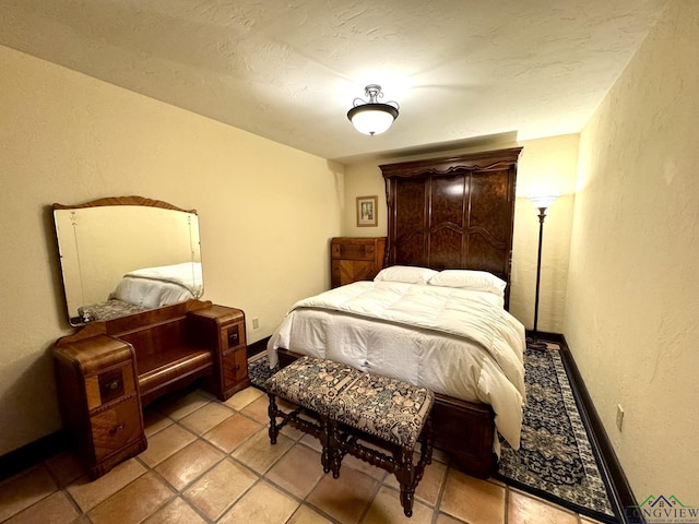 bedroom featuring light tile patterned floors