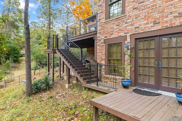 exterior space featuring a wooden deck and french doors