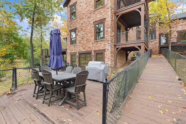 wooden deck featuring grilling area