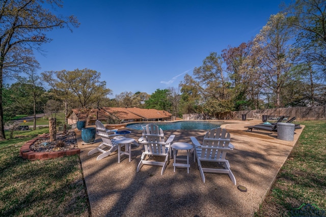 view of swimming pool with a patio area