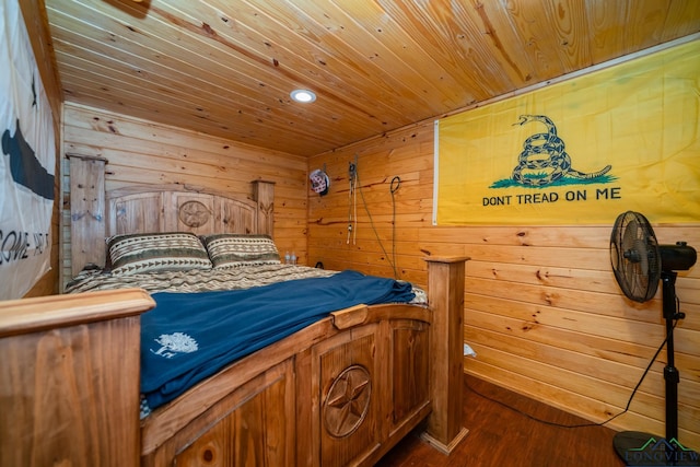 bedroom with hardwood / wood-style floors, wood walls, and wood ceiling