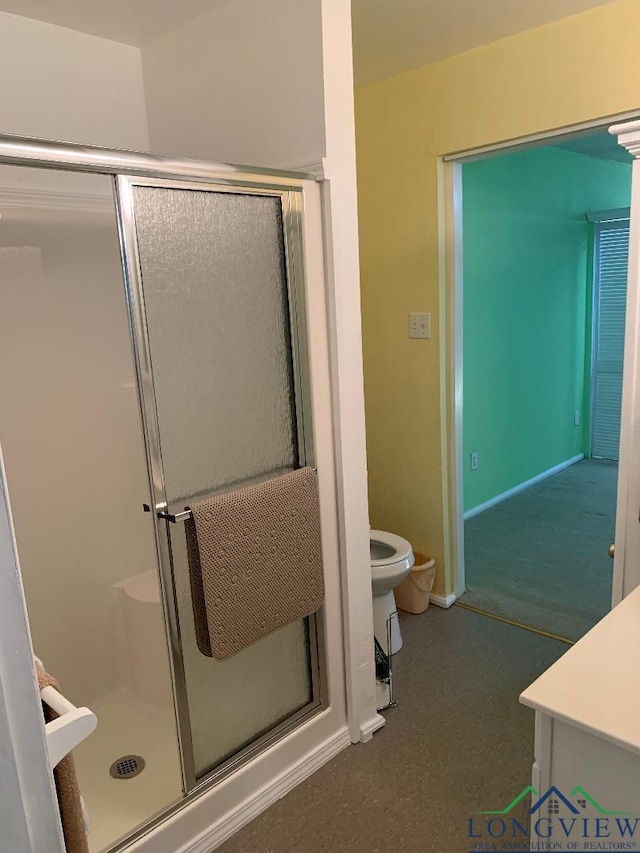 bathroom with toilet and walk in shower