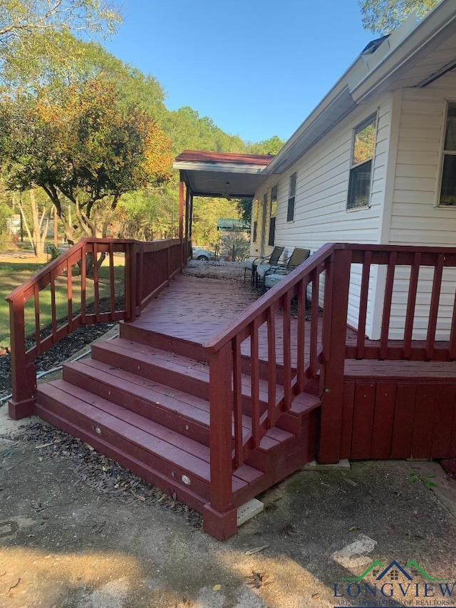 wooden terrace featuring area for grilling