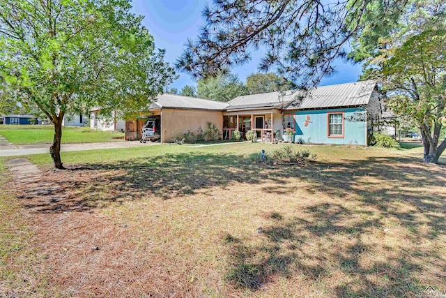 ranch-style home with a front yard