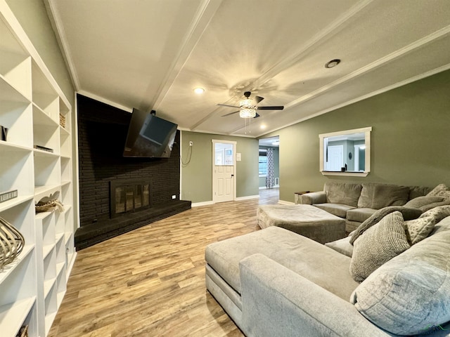 2305 Buccaneer Dr, Longview, TX 75604 - living room with a brick fireplace, wood finished floors, crown molding, ceiling fan, and recessed lighting