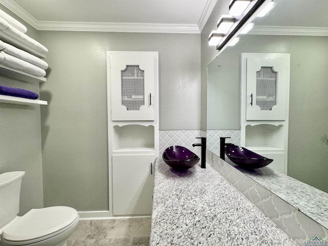 2305 Buccaneer Dr, Longview, TX 75604 - bathroom featuring crown molding, a sink, and toilet