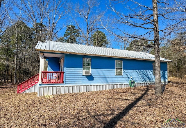 view of home's exterior with metal roof