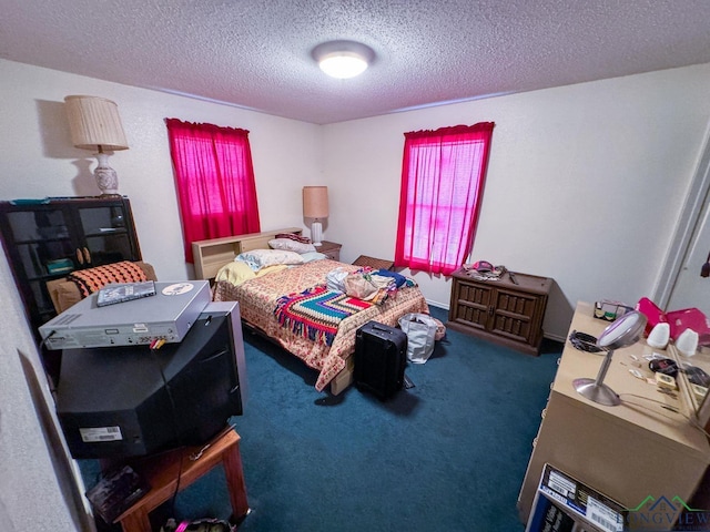 carpeted bedroom featuring a textured ceiling