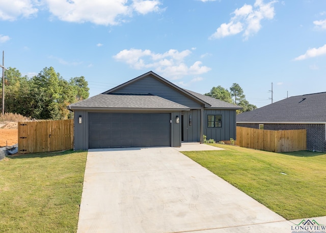 ranch-style home with a garage and a front yard