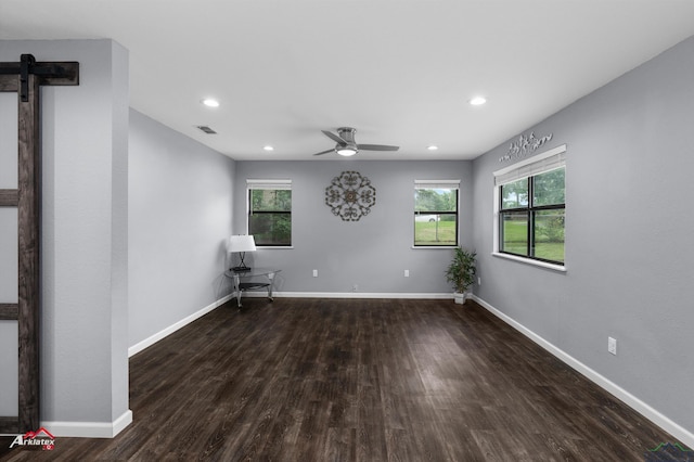 spare room featuring wood finished floors, plenty of natural light, baseboards, a ceiling fan, and recessed lighting