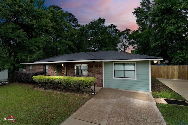 single story home featuring brick siding