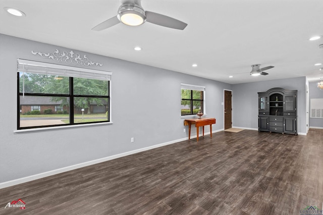 unfurnished living room featuring a ceiling fan, recessed lighting, dark wood-style floors, and baseboards