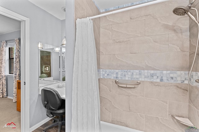 bathroom with tiled shower