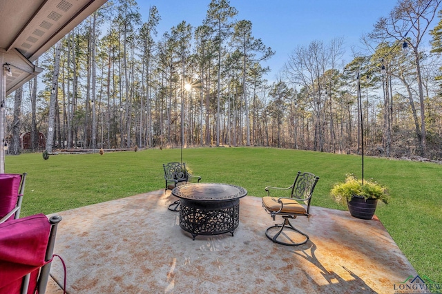 view of patio with an outdoor fire pit