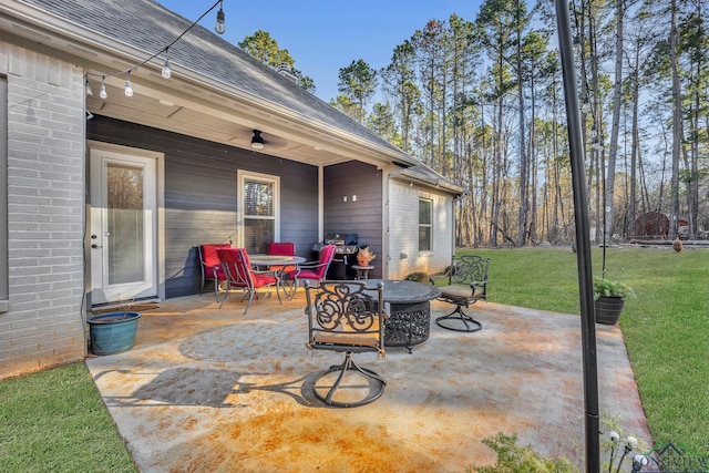 view of patio / terrace featuring ceiling fan and grilling area