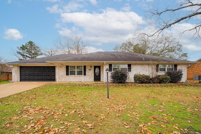 ranch-style home featuring a front lawn and a garage