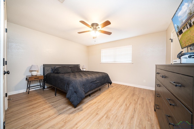 bedroom featuring light hardwood / wood-style floors and ceiling fan