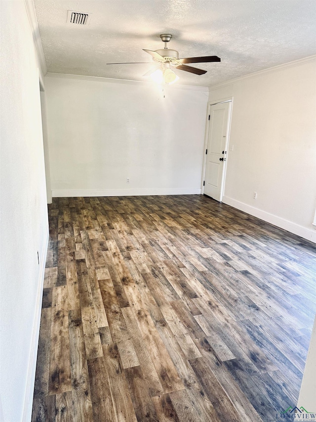 unfurnished room with dark hardwood / wood-style flooring, a textured ceiling, and ornamental molding