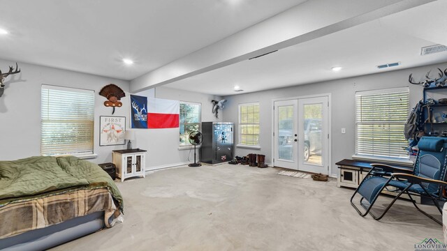 128 Inwood Rd, Texarkana, TX 75501 - bedroom featuring visible vents, baseboards, concrete flooring, french doors, and access to exterior