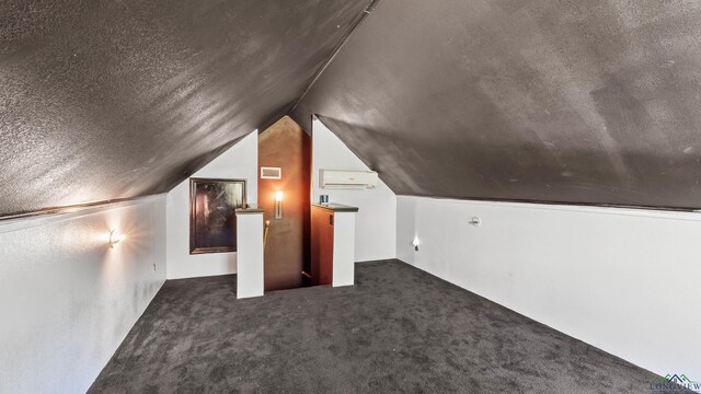 128 Inwood Rd, Texarkana, TX 75501 - bonus room featuring visible vents, an AC wall unit, carpet, a textured ceiling, and lofted ceiling