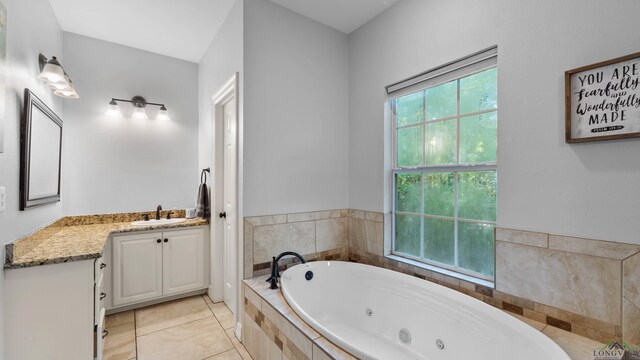 128 Inwood Rd, Texarkana, TX 75501 - bathroom with a whirlpool tub, tile patterned floors, and vanity