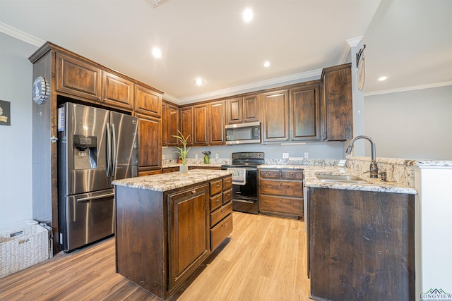 kitchen with sink, light hardwood / wood-style flooring, appliances with stainless steel finishes, light stone counters, and kitchen peninsula