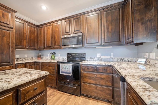 kitchen featuring appliances with stainless steel finishes, light wood-type flooring, dark brown cabinetry, and crown molding