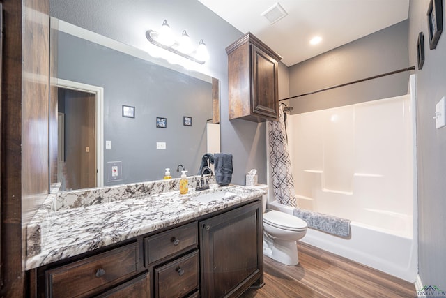 full bathroom featuring shower / bath combo, vanity, toilet, and wood-type flooring