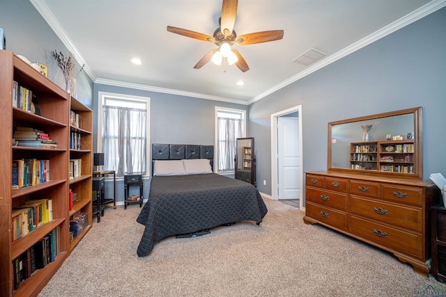 carpeted bedroom featuring ceiling fan and crown molding