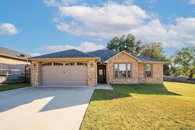 ranch-style home featuring a front lawn and a garage