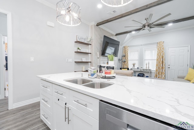 kitchen featuring a sink, white cabinetry, ornamental molding, light stone countertops, and dishwasher