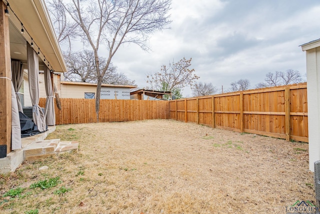 view of yard featuring a fenced backyard