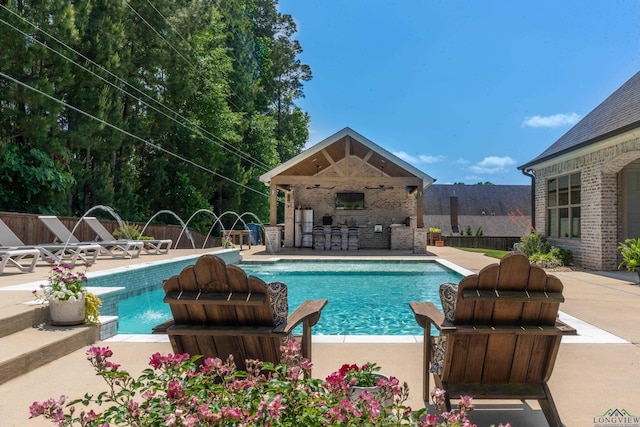 view of pool with a patio, exterior fireplace, fence private yard, and a fenced in pool