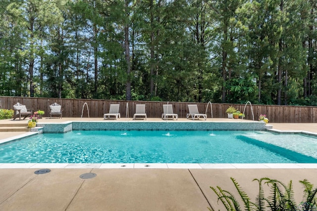 view of swimming pool featuring a fenced in pool, fence, and a patio