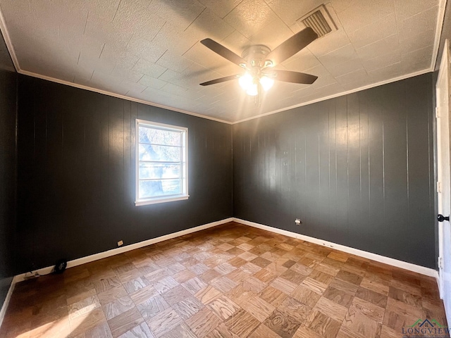 unfurnished room featuring crown molding, light parquet flooring, and ceiling fan