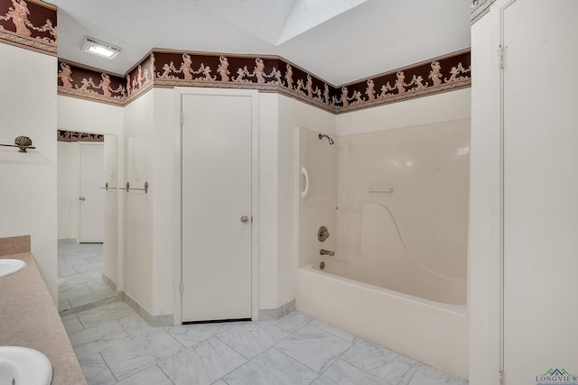 111 E Sycamore Ln, Longview, TX 75604 - full bath with marble finish flooring, double vanity, and bathing tub / shower combination