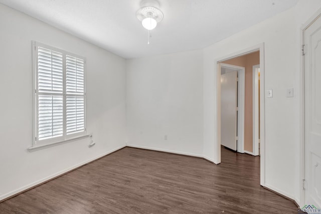 111 E Sycamore Ln, Longview, TX 75604 - empty room featuring plenty of natural light and dark wood-type flooring