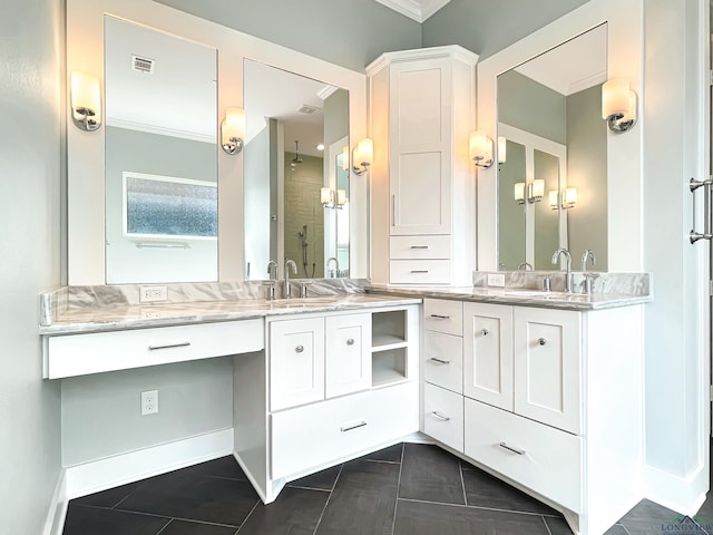 7323 Lake Pointe Cv, Tyler, TX 75703 - full bath with visible vents, crown molding, tile patterned flooring, two vanities, and a sink