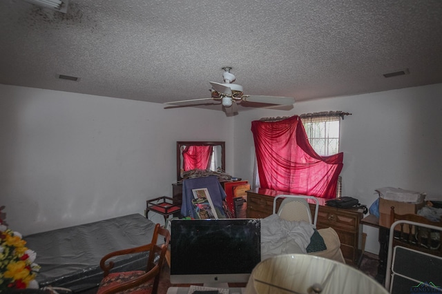 1006 Quitman St, Pittsburg, TX 75686 - bedroom featuring a textured ceiling and ceiling fan