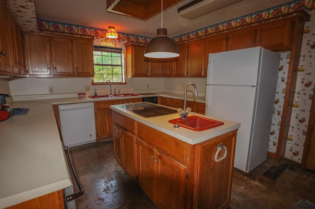 1006 Quitman St, Pittsburg, TX 75686 - kitchen with white appliances, a sink, light countertops, and brown cabinets
