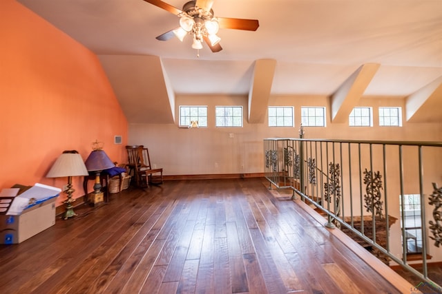 additional living space featuring hardwood / wood-style floors, vaulted ceiling, a wealth of natural light, and ceiling fan