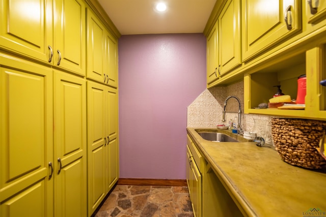 kitchen with sink and tasteful backsplash