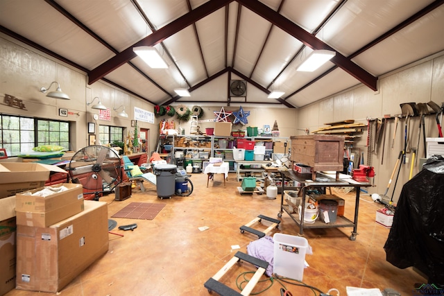 interior space with a workshop area and lofted ceiling