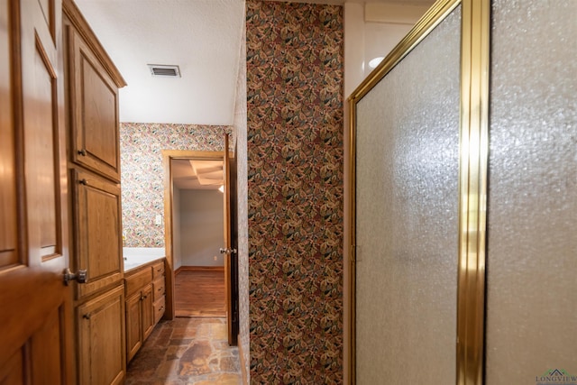 bathroom featuring vanity and walk in shower